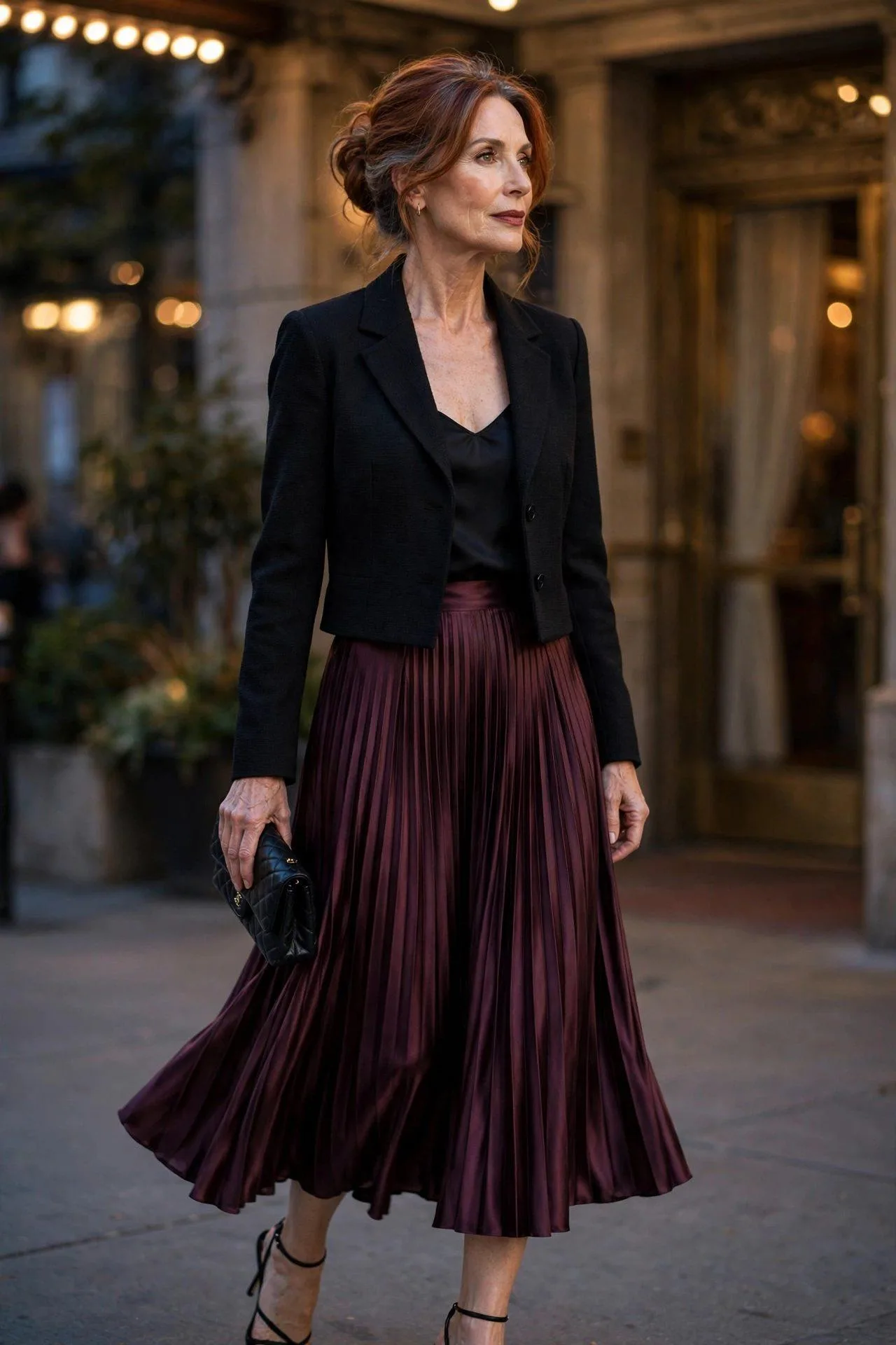 Elegant lady wearing wine pleated skirt with short black jacket