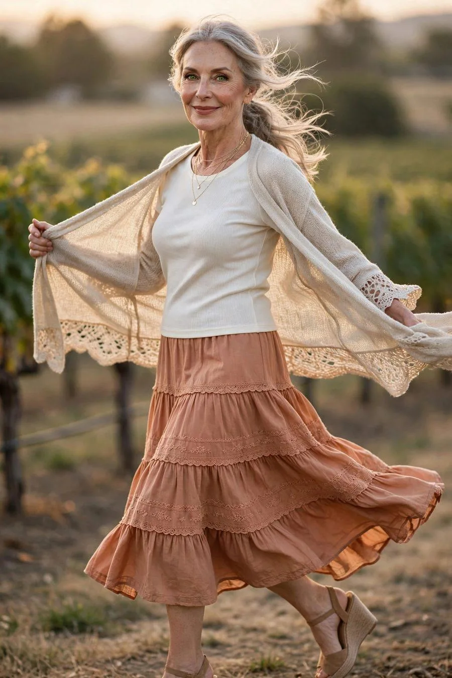 Graceful mature woman in terracotta tiered midi skirt with cardigan at dinner