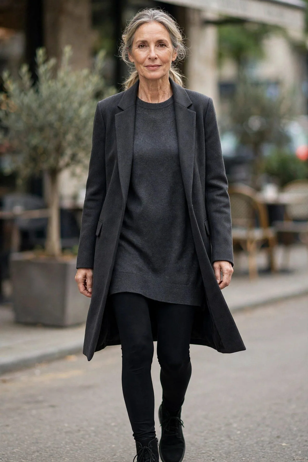 Longline dark jacket giving coverage over leggings and tunic