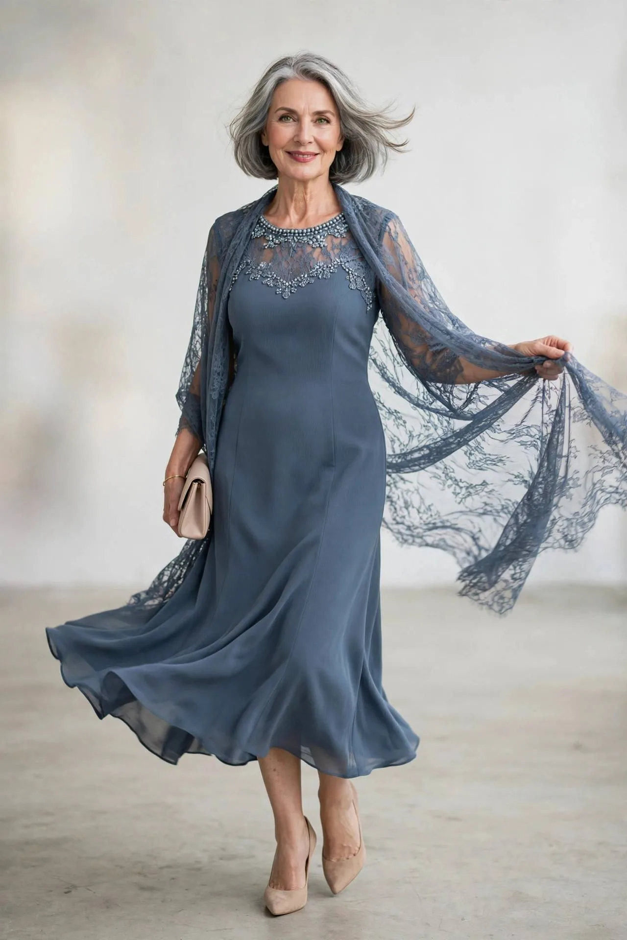 Elegant woman over fifty wearing slate blue crepe sheath dress