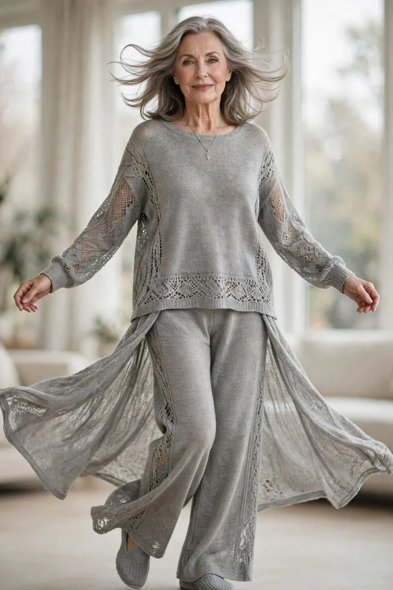 Graceful mature woman doing gentle stretches in a sunny living room in soft knitwear.