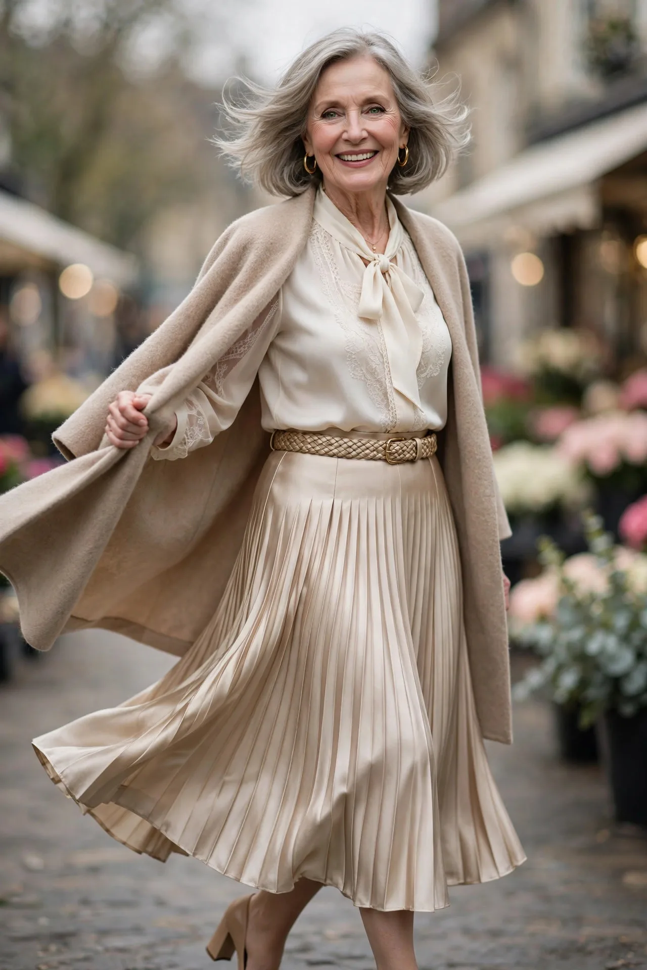 Pleated Silk Poise — An ivory silk blouse with a soft pussy-bow neckline tucked into a champagne knife-pleated midi skirt, with nude block heels and a woven belt.