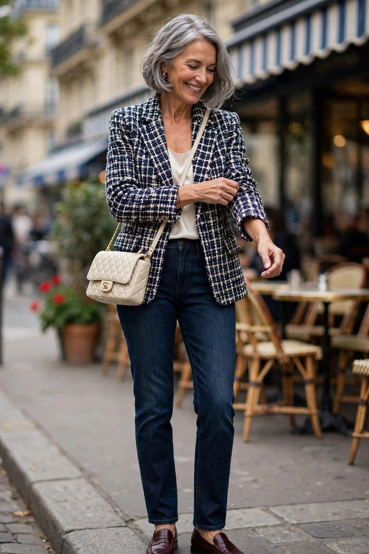 Fashionable senior separating tweed jacket, wearing it with jeans and loafers