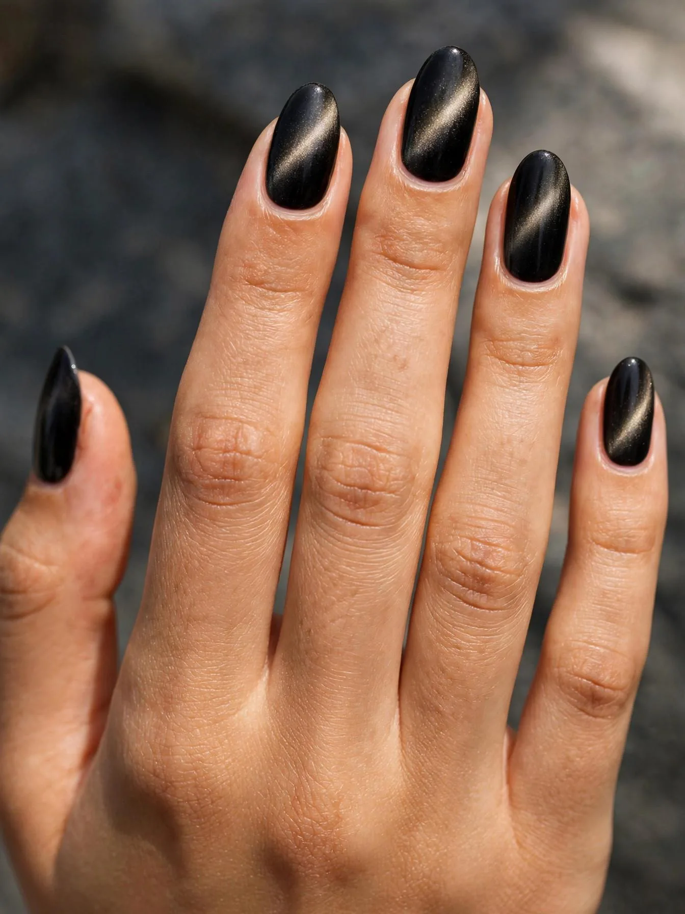 Medium almond nails in espresso black magnetic cat eye velvet.