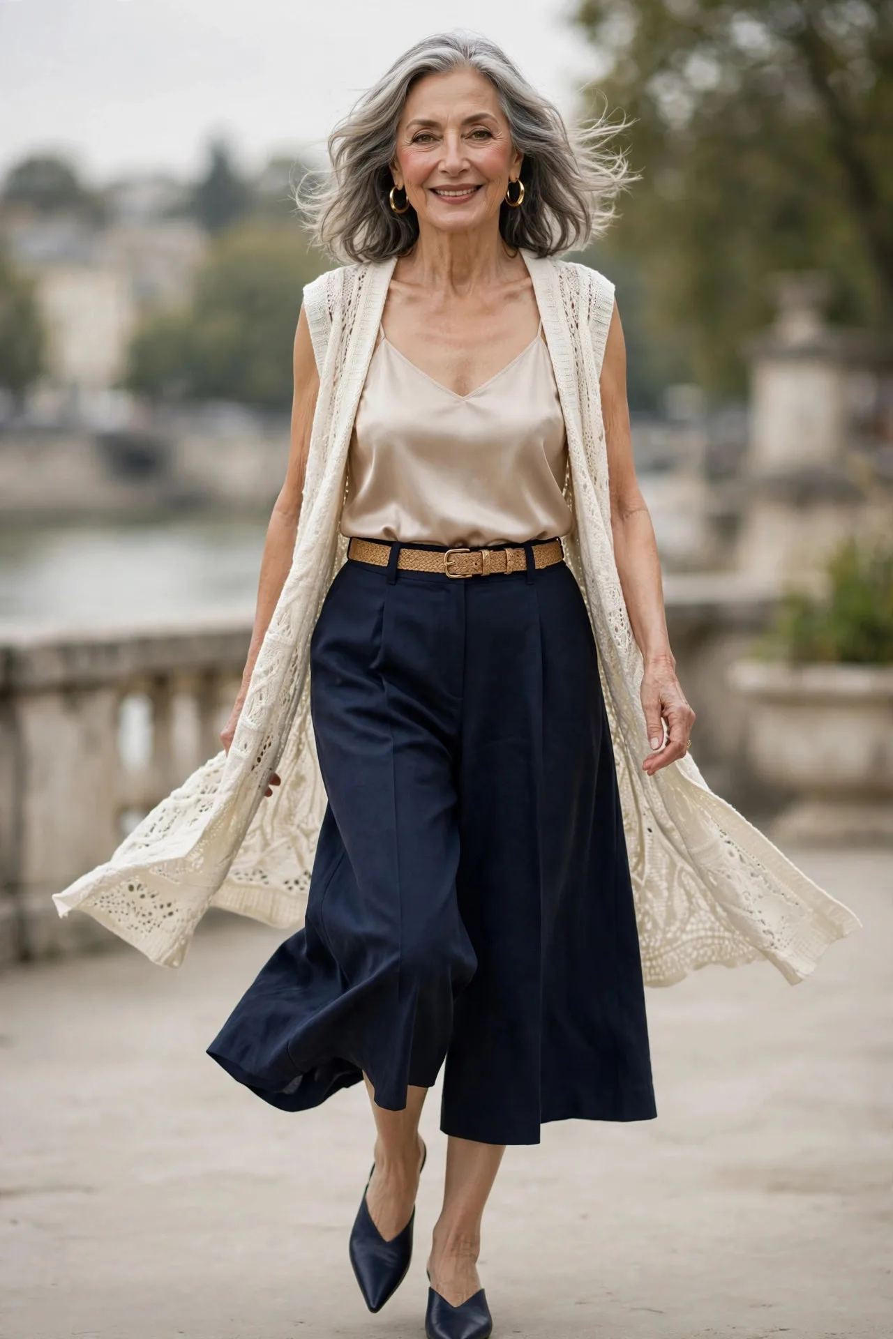 Culotte Chic — A champagne silk camisole tucked into high-waisted navy culottes, with an open ivory knit vest over the top and pointed mules.