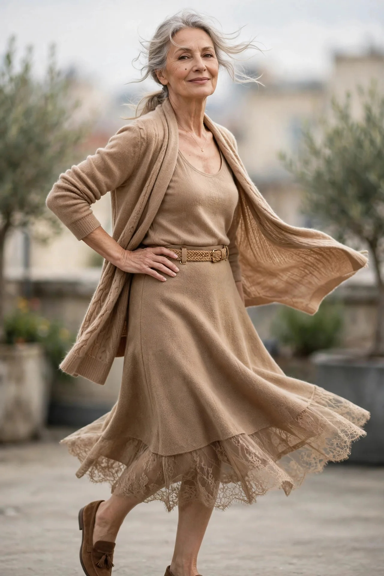 Twinset Grace Notes — A camel cashmere cardigan worn open over a matching camel silk-knit tank, with a camel wool A-line midi skirt and brown suede loafers.