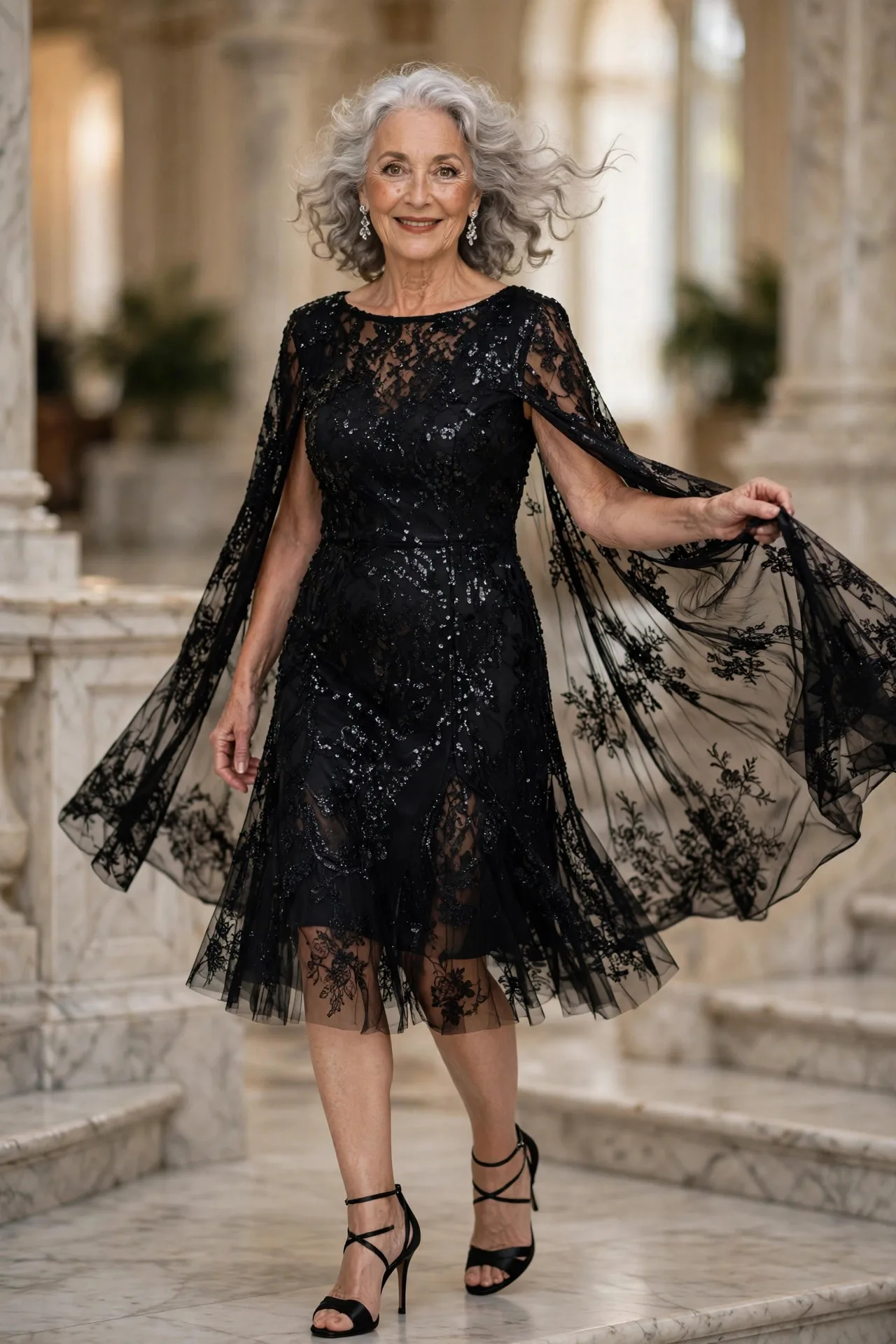 Starlight Cape Drama — A black sequin cape-sleeve cocktail dress in knee length with a boat neckline, worn with black satin strappy heels.