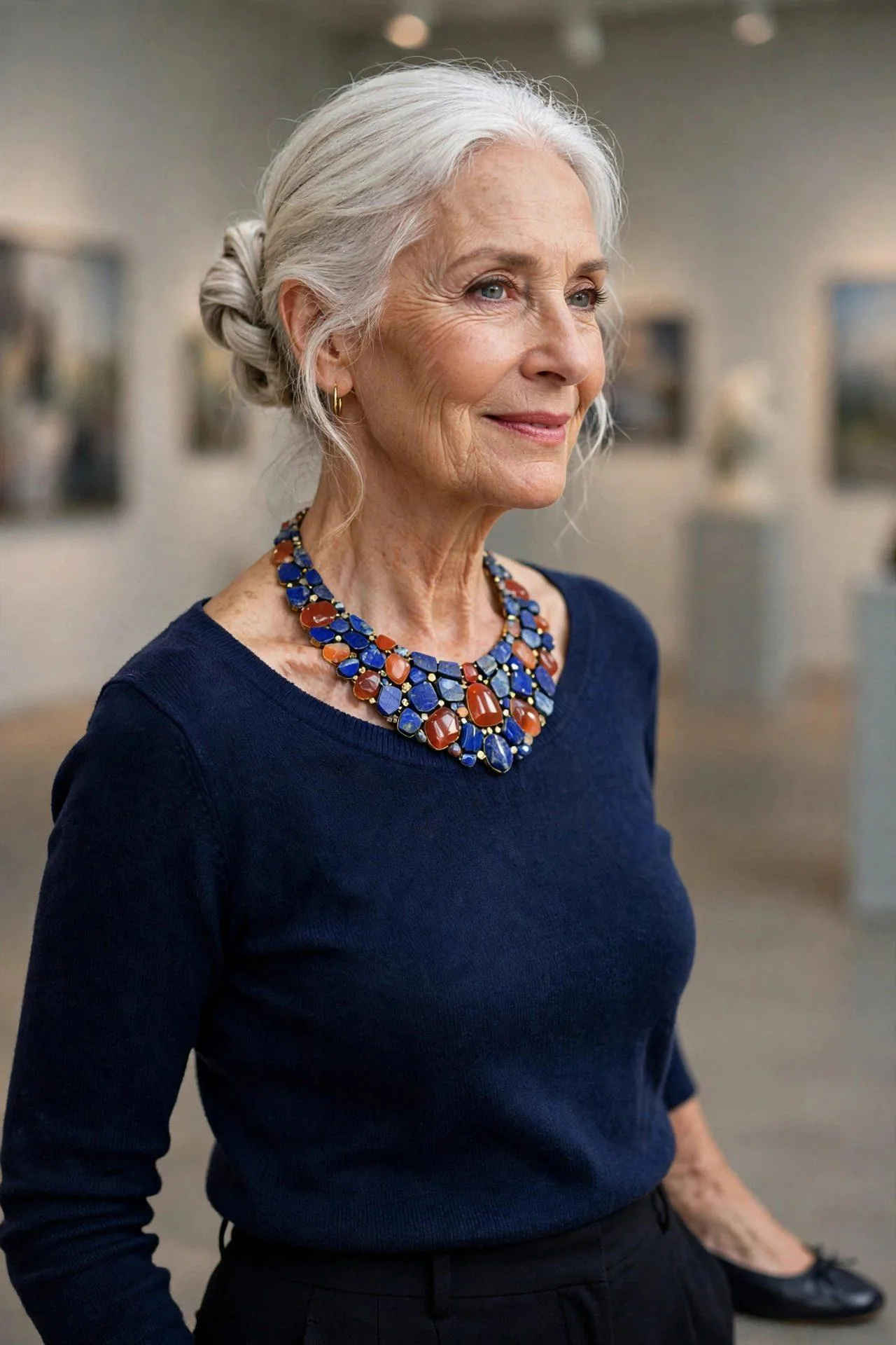 Lapis and carnelian bib necklace filling a wide scoop neckline elegantly.