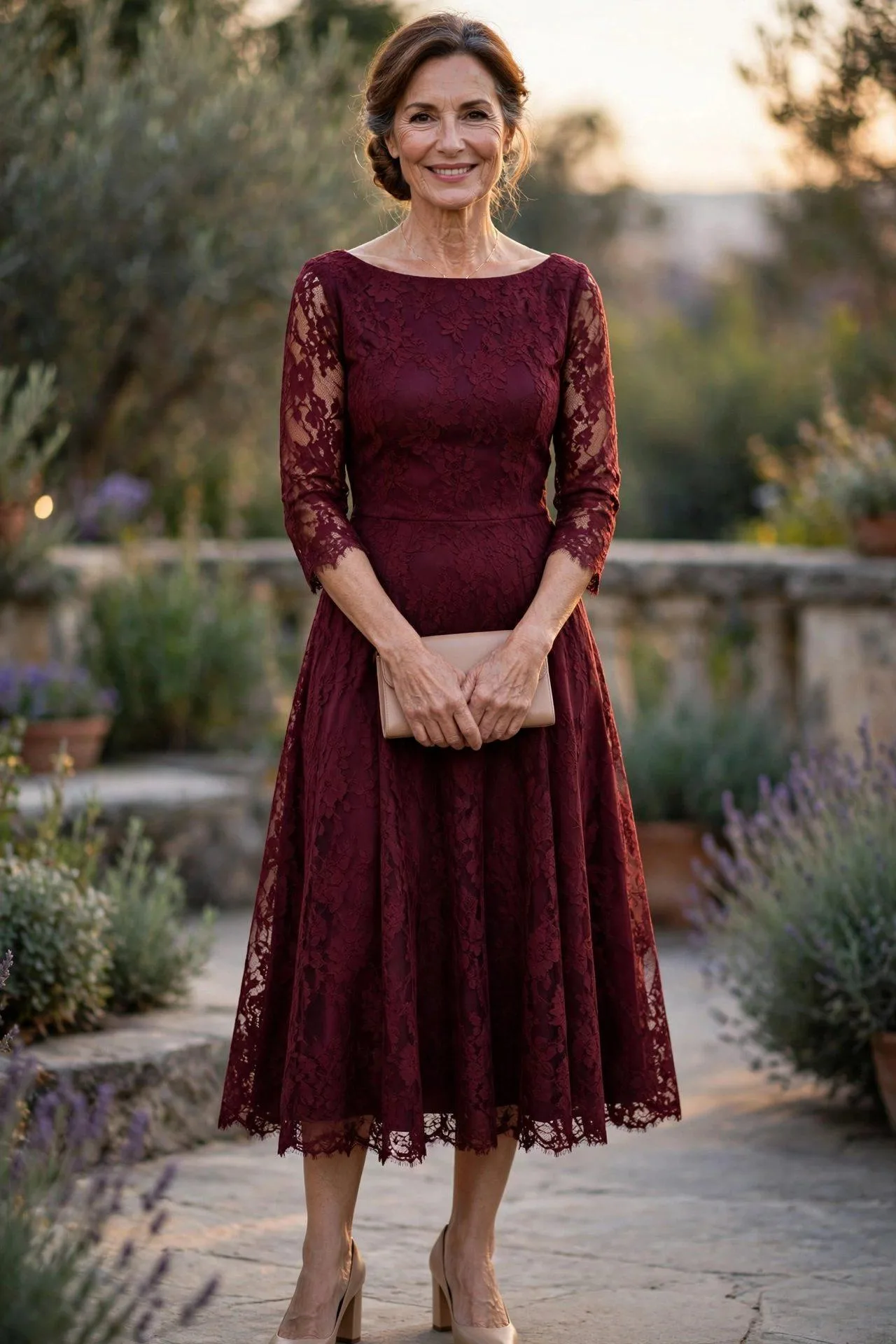 Woman in her late fifties in an elegant burgundy lace midi dress at golden hour