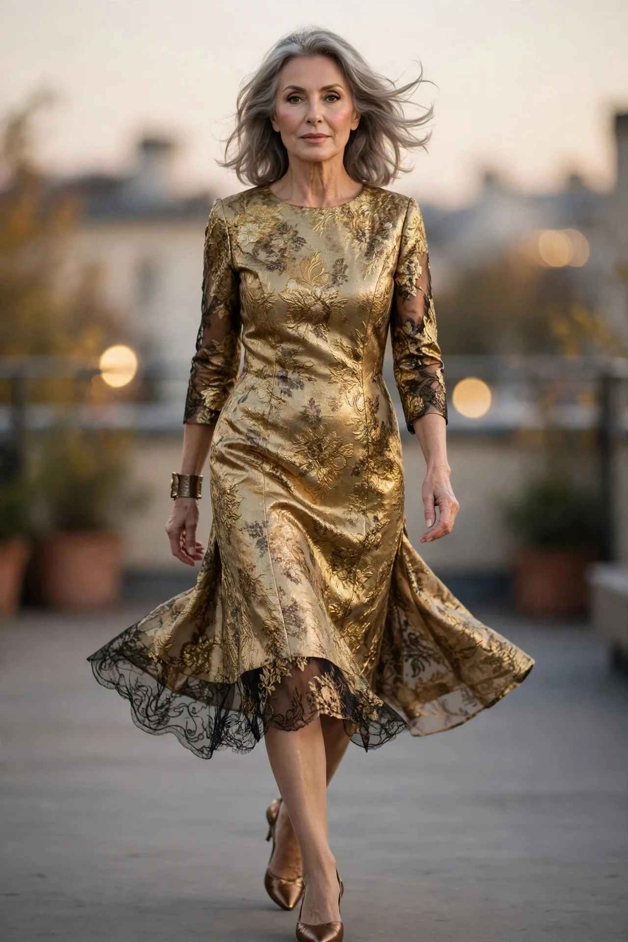 Joyful mature woman in gold brocade knee-length dress with bronze heels